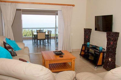 Lounge opens on to balcony. Stackable doors provide a wonderful sea view from the lounge.