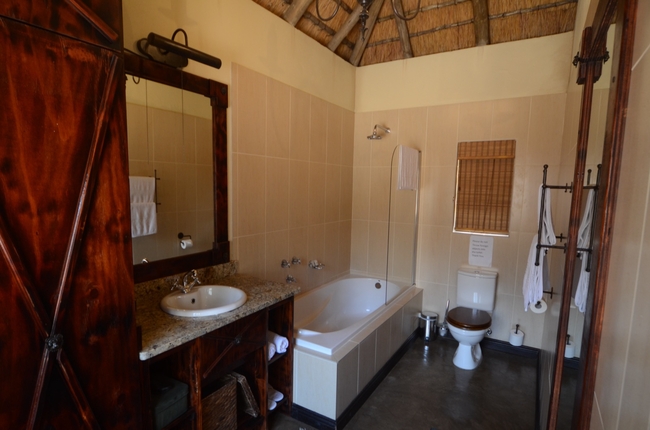 Bathroom with bath and shower