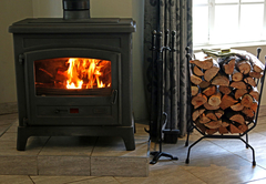 Lodge fireplace has a bundle of complimentary firewood provided daily