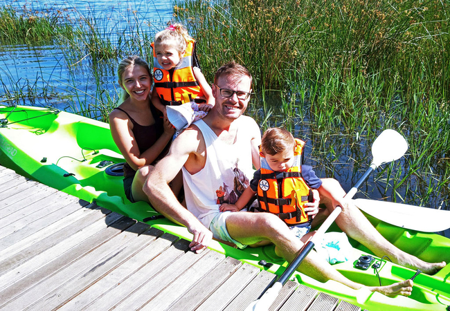 Family enjoying time using a kayak