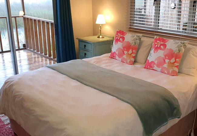 Cabin bedroom has a queen bed and electric blanket