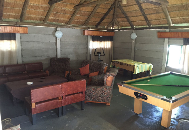 Lounging area with pool table, TV and fooseball table