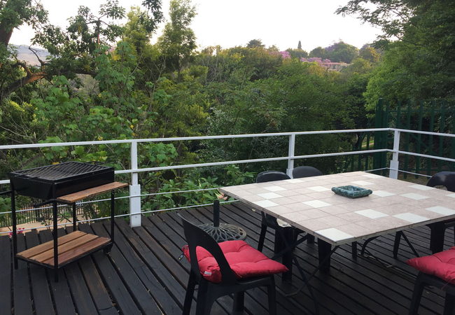 Apartment C - Deck with seating and braai facilities