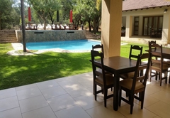 Swimming pool viewed from the patio of the dining area